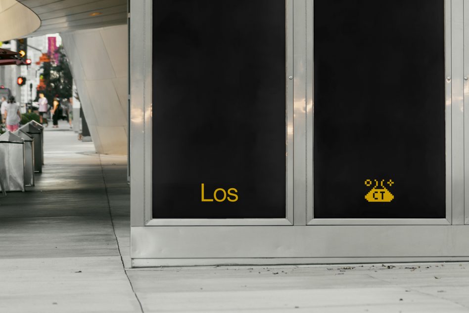 Urban storefront mockup with stylized text on glass window, city background, ideal for display font and branding design.